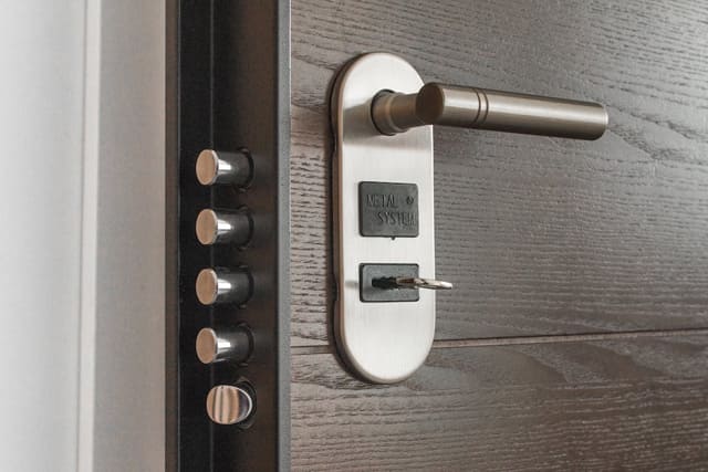 House door with a key inserted in the lock